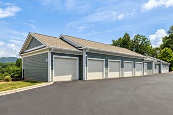 a row of garages with a blue sky in the background